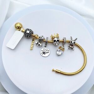 Linx Yellow Gold Snake Chain Bracelet with Mama and Skull Themed Charms
